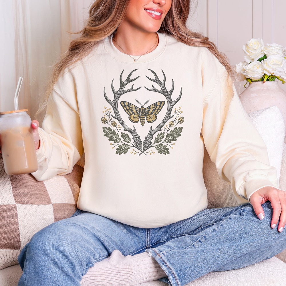 Eyespot Moth Resting Within an Antler Crown Sweatshirt